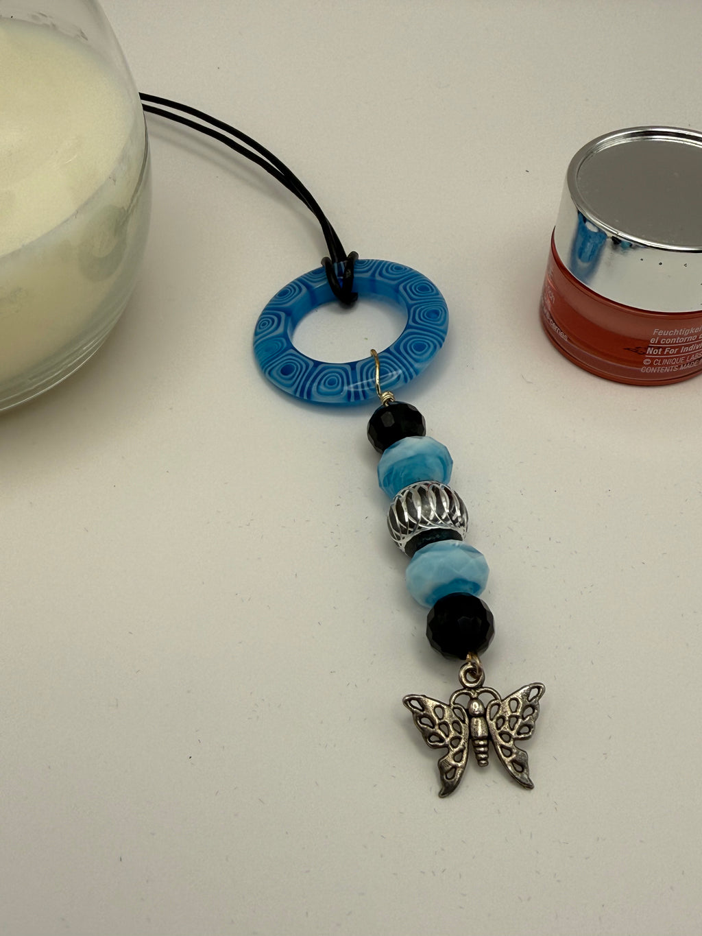 Blue Beaded Circle Pendant Necklace with Butterfly Charm