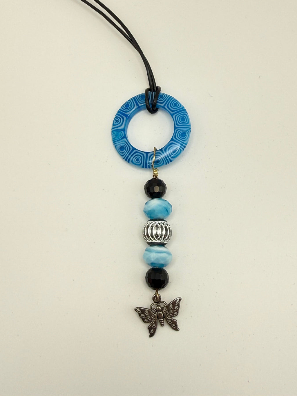 Blue Beaded Circle Pendant Necklace with Butterfly Charm