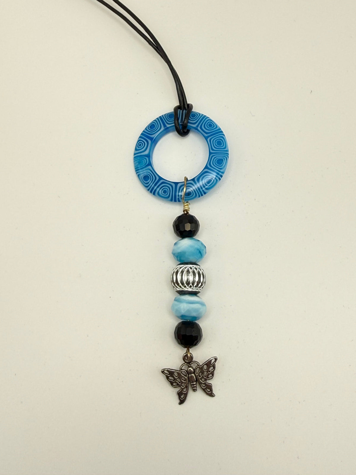 Blue Beaded Circle Pendant Necklace with Butterfly Charm