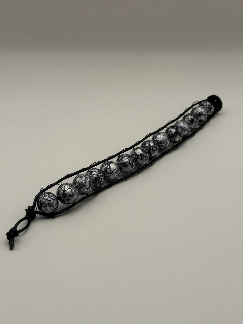 Black & Grey Marled Beaded Cord Bracelet with Button Fastener.