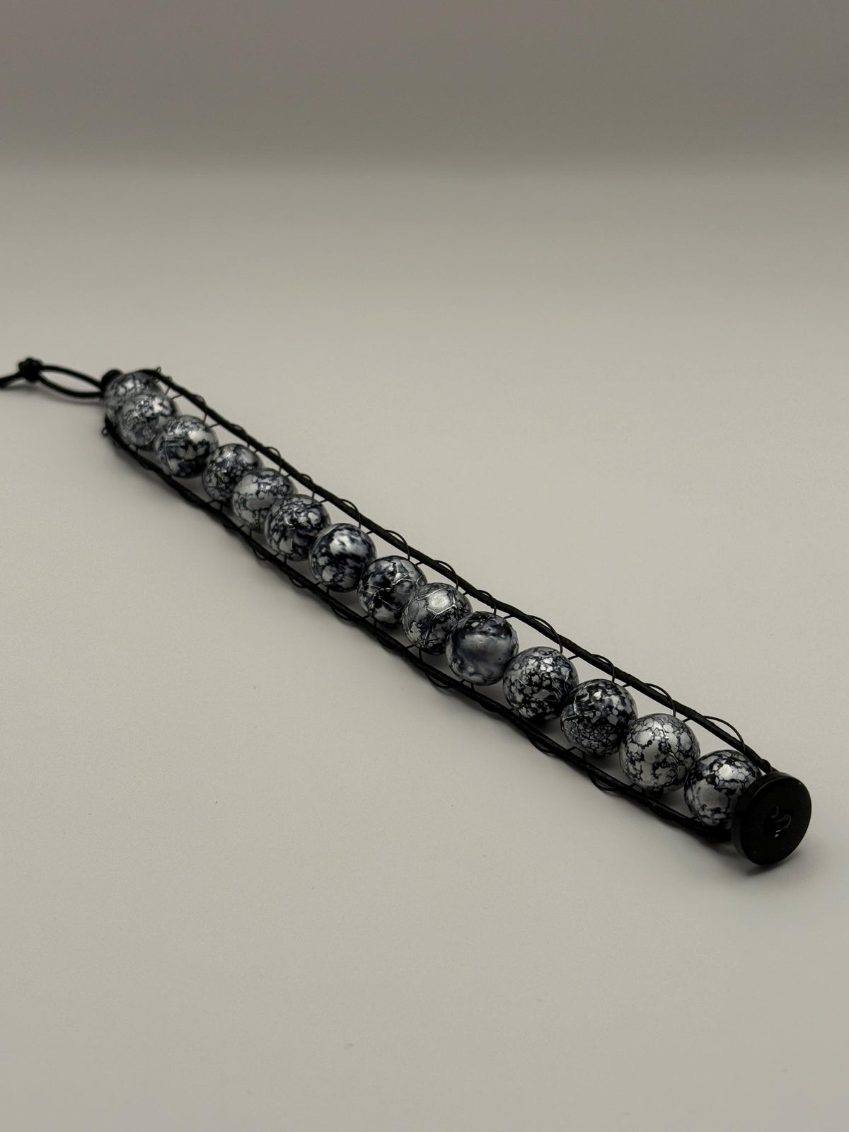Black & Grey Marled Beaded Cord Bracelet with Button Fastener.
