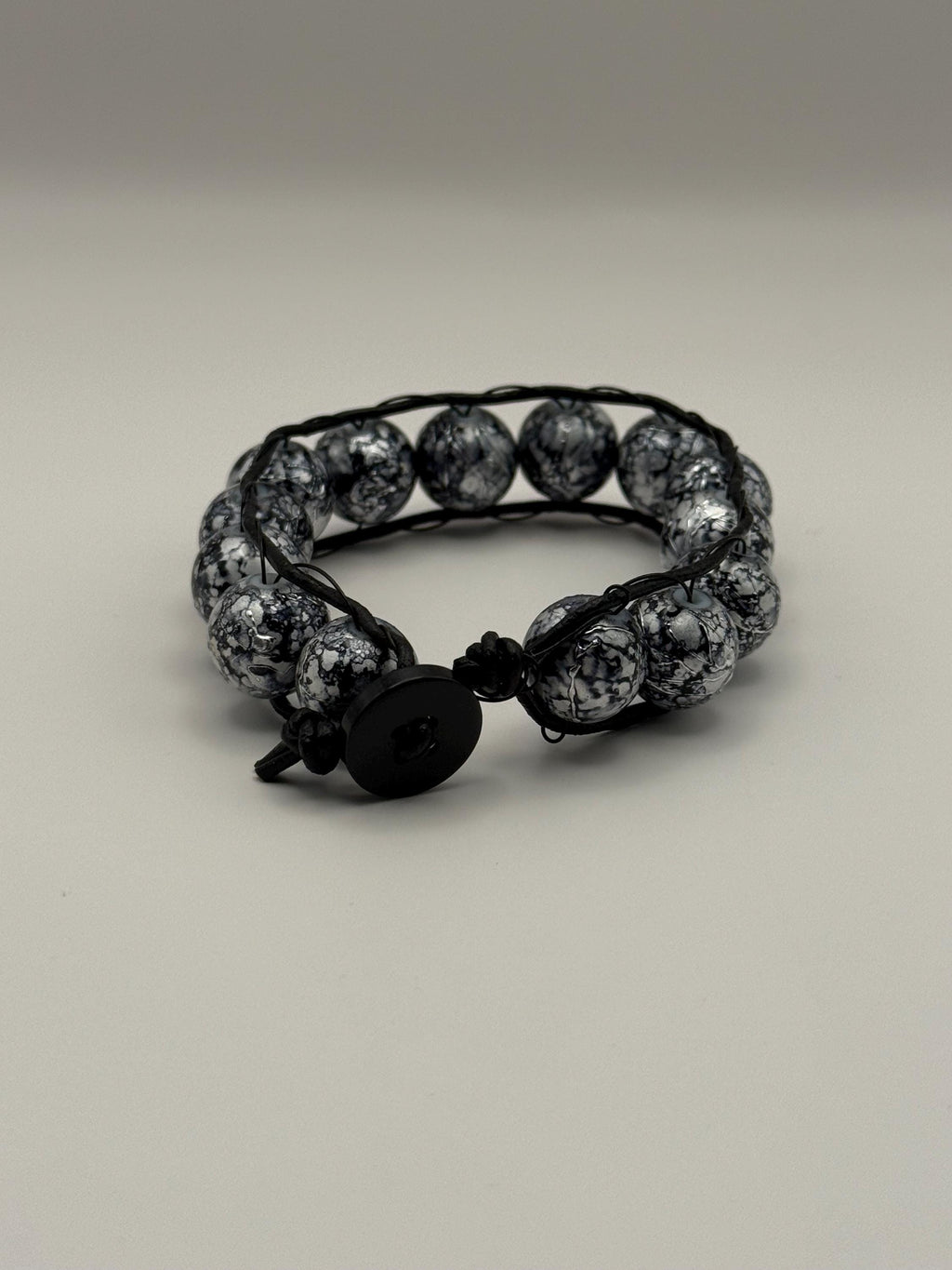Black & Grey Marled Beaded Cord Bracelet with Button Fastener.