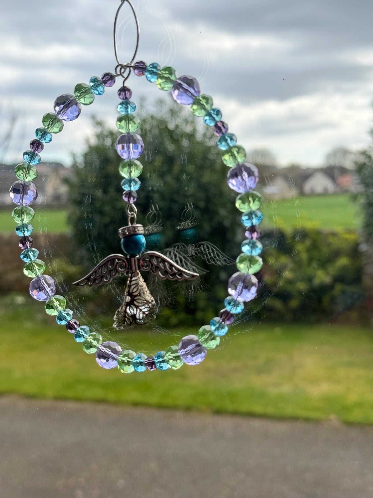 Angel Suncatcher â€“ Beaded Circle Window Hanging