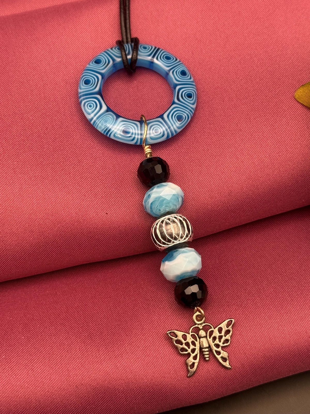 Blue Beaded Circle Pendant Necklace with Butterfly Charm